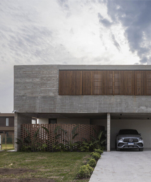 adjustable sunshades animate rustic facade in argentine residence by TIM arquitectos