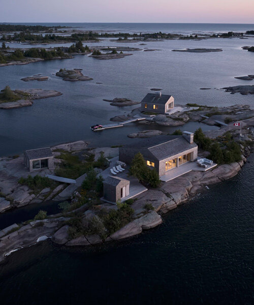 clustered 'whistling wind' cabins by akb architects perch atop tiny canadian island