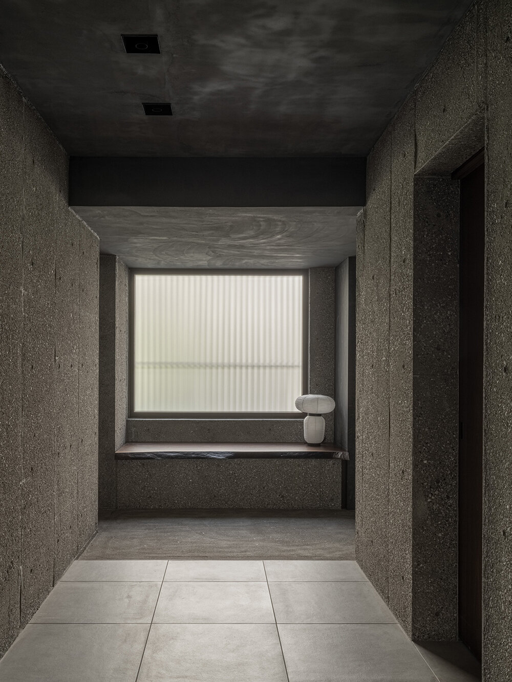 keiji ashizawa's house in aoyama is a concrete body with protruding wooden louvers