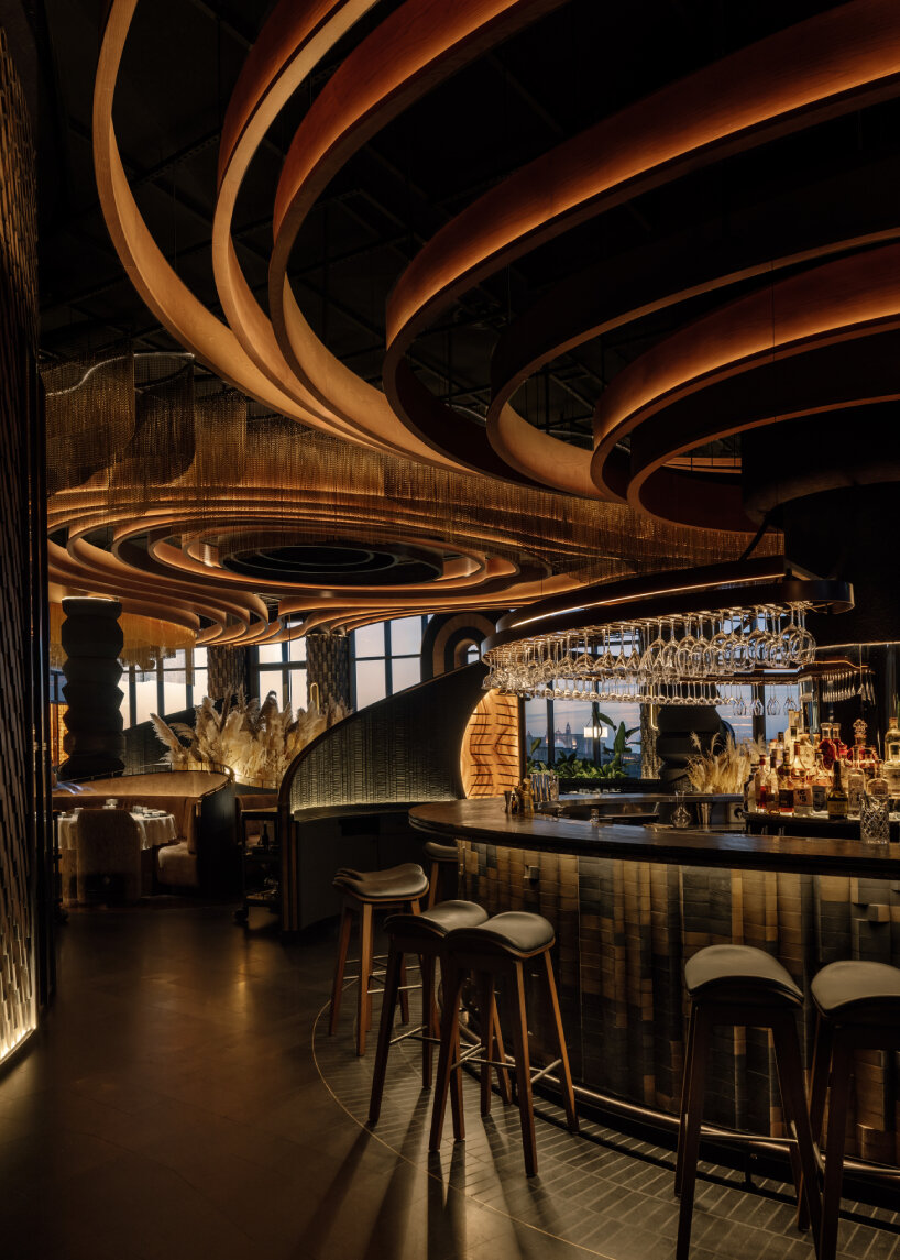 Essence of charred wood and fire immerses the nighttime restaurant of Astet Studios in Dubai