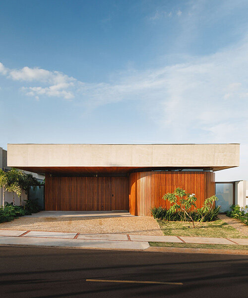 brazilian architect laercio fabiano curates warm, modern design with dali twins house