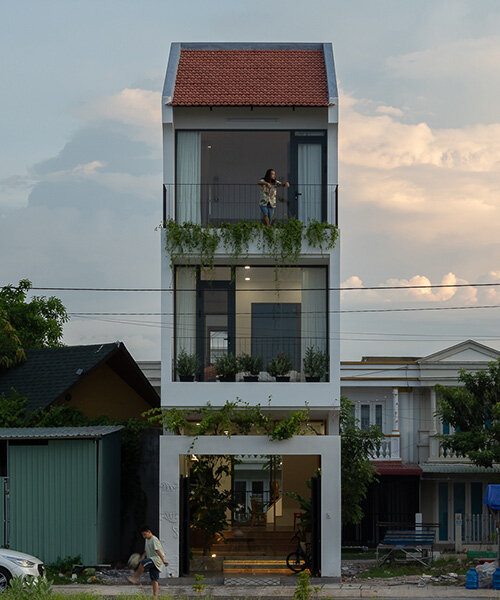 dual facades and central skylight illuminate dat tran's residence in western vietnam