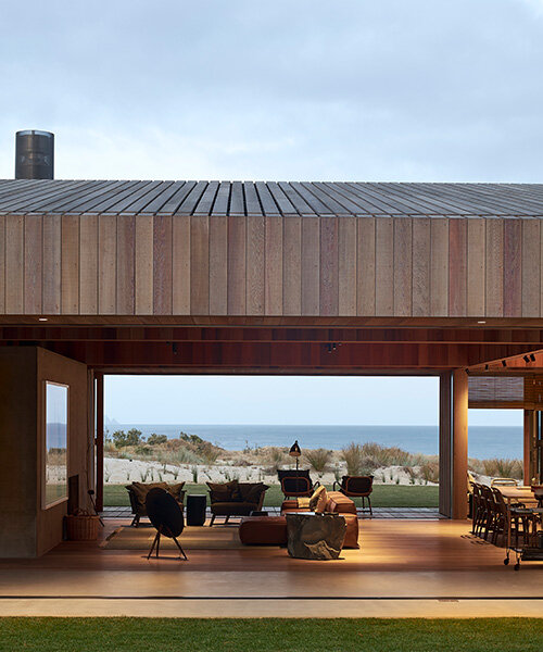 fearon hay's 'te arai' house frames dunes through timber shutters