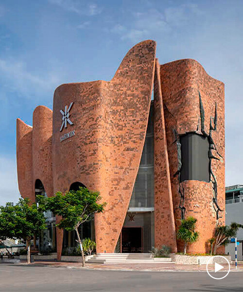 fluid brick-clad facade undulates around karinox coffee shop in vietnam