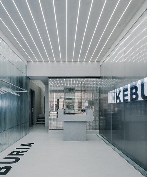 stainless steel and mirrors reflect keburia retail space's futuristic interior in georgia