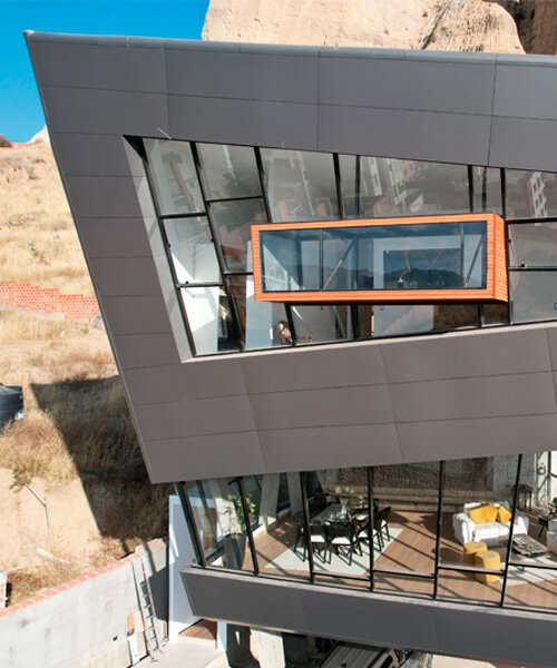 levitae house's large fragmented volumes cantilever above mountain in bolivia