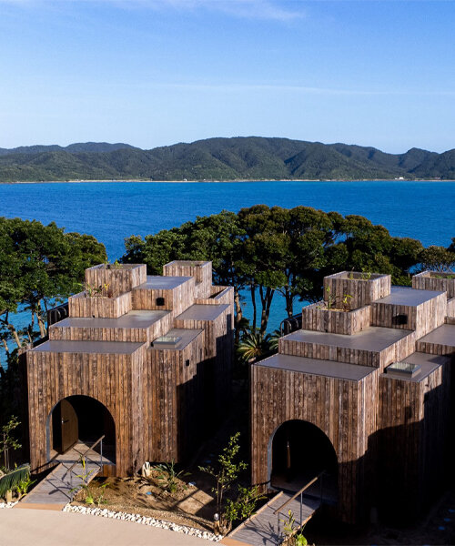 miru amami resort welcomes cavernous and stilted wooden villas overlooking japanese bay