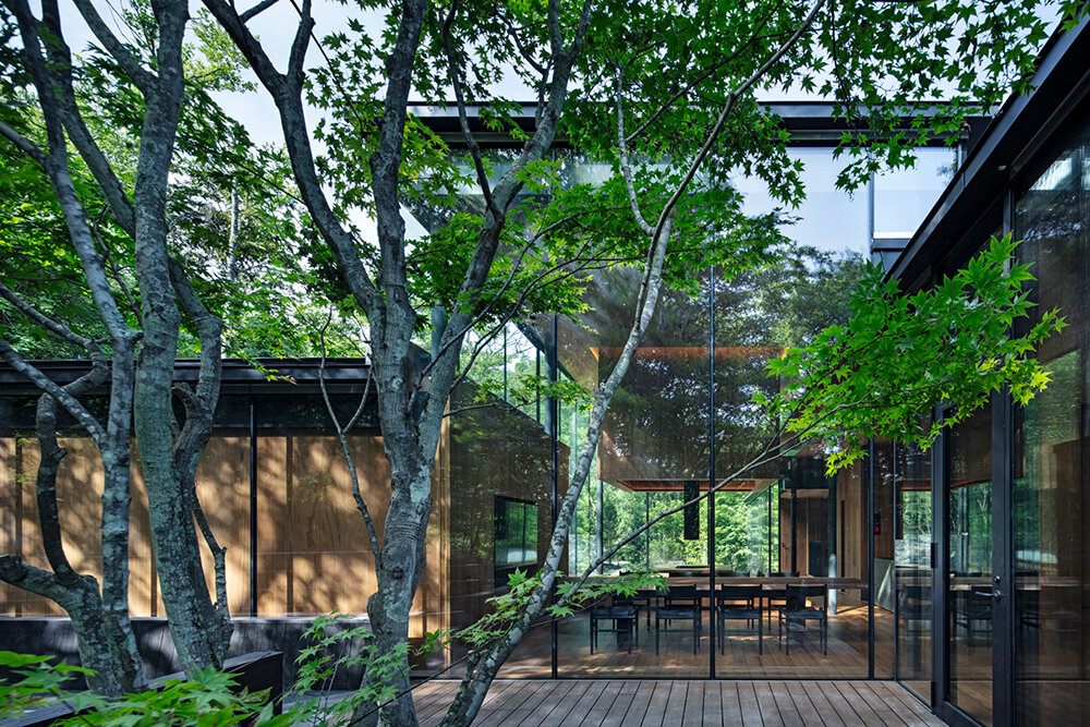 KEIN HOTEL KITAKARUIZAWA IRORI combines wood and glass in the middle of a Japanese forest