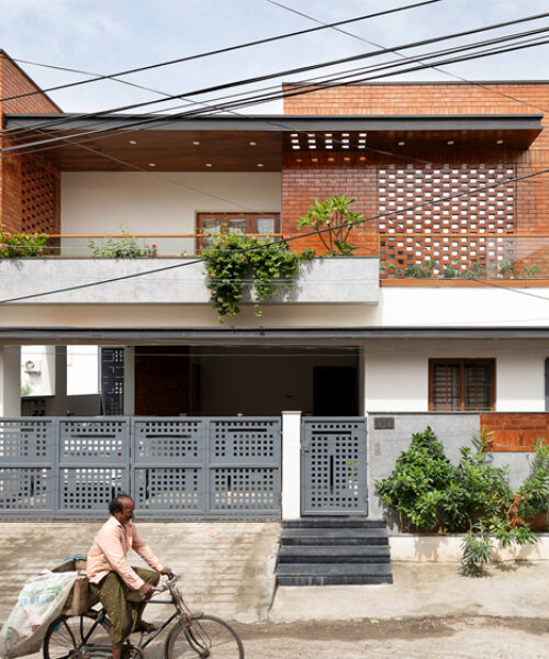 perforated brick planes invite light and shade into D.L.E.A's house in chennai