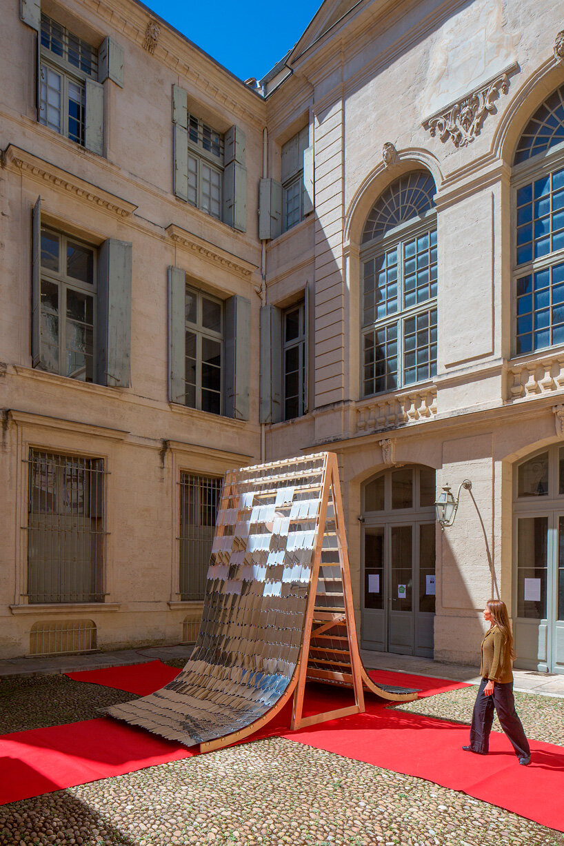 kinetic mirror pavilion's living facade rhythmically reflects french monument for paris 2024