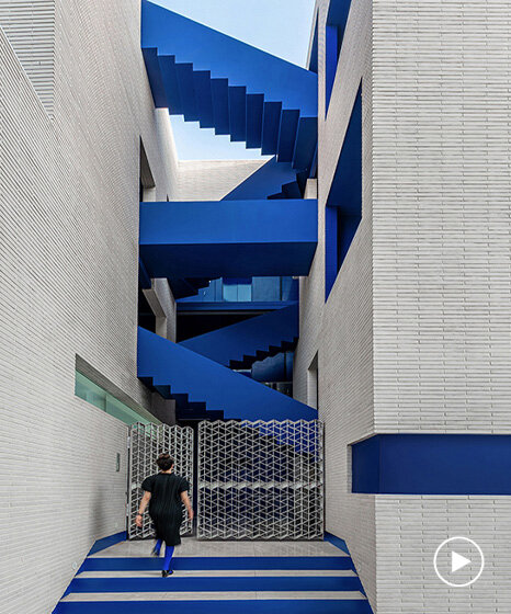 vibrant blue staircases connect courtyard-centric iranian residence by rooydaad architects