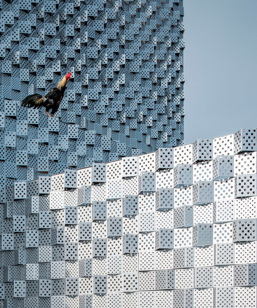 ayutt & associates' salient house is surrounded with glass block fence in thailand