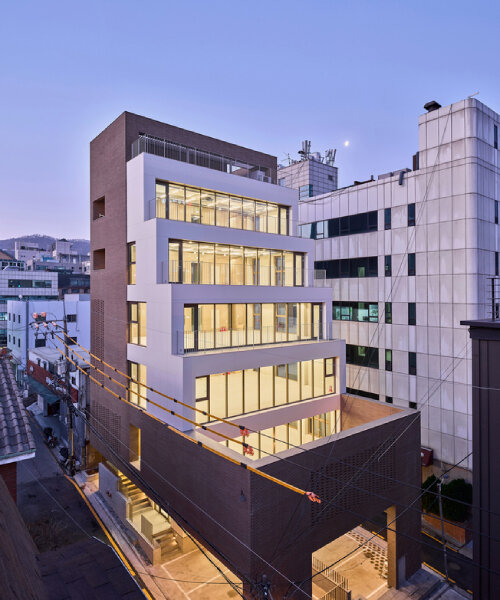 stepped facade extends from brick volume in mlnp architects' mixed-use building in seoul