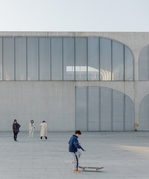 tianzhou yang captures concrete curves and coal hopper remnants at long museum, shanghai