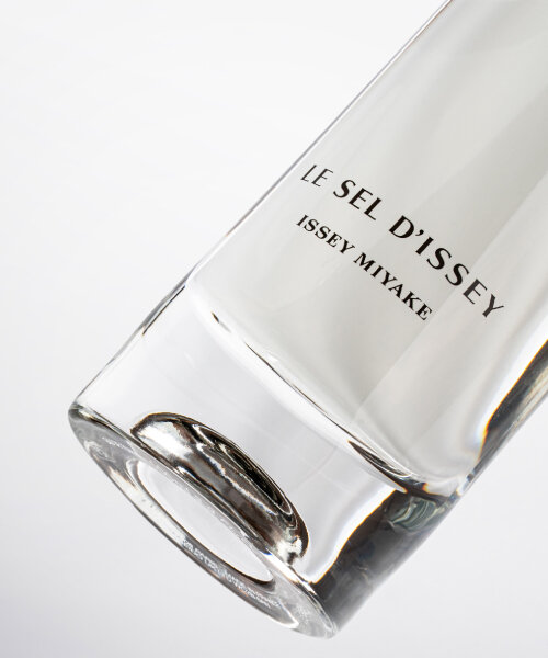 tokujin yoshioka’s issey miyake perfume emits light into the bottle from its oval glass bottom