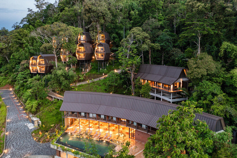 m j kanny architect plants cluster of nest-like chalets on malaysian hillside