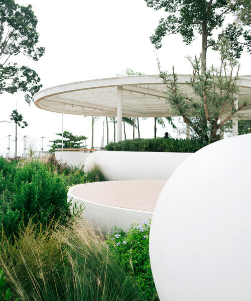 an array of white pebble-like forms shapes VMA's coastal restaurant in thailand