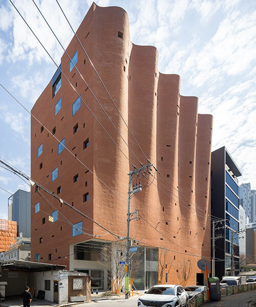 rippling brick facade by behet bondzio lin architekten envelops textile headquarters in seoul