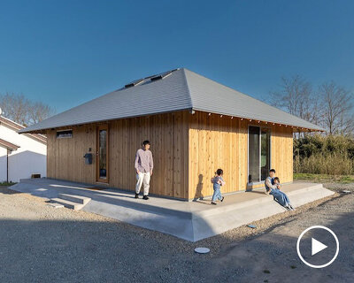 wooden house by architrip extends fluily into surrounding garden in japan