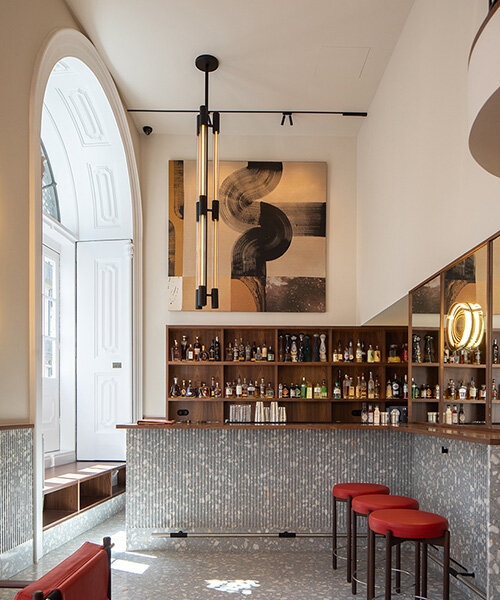 atelier sérgio rebelo converts historic bank building into multi-space restaurant in porto