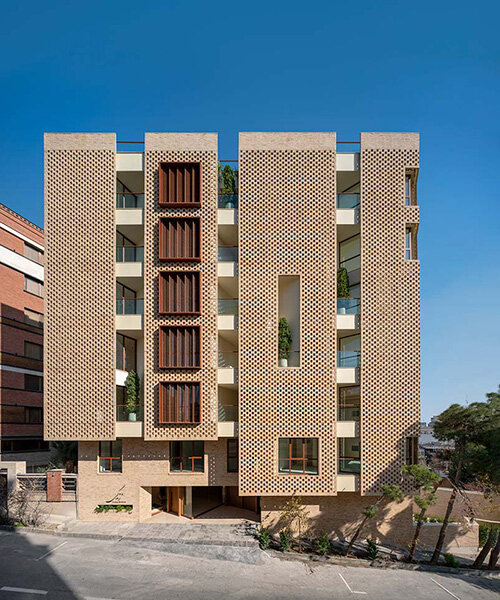 brick-layered facade shields zendegi building from harsh sunlight in tehran