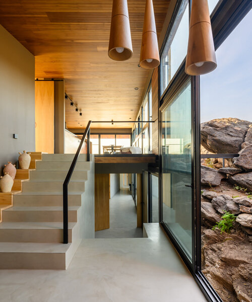 casa en piedras: estudio palacios nests modern home among large stones in argentina