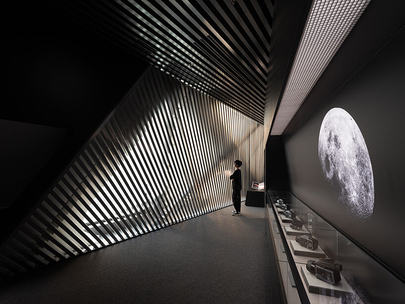 faceted glass curtain walls flood DJI's shenzhen origami-like flagship store with sunlight