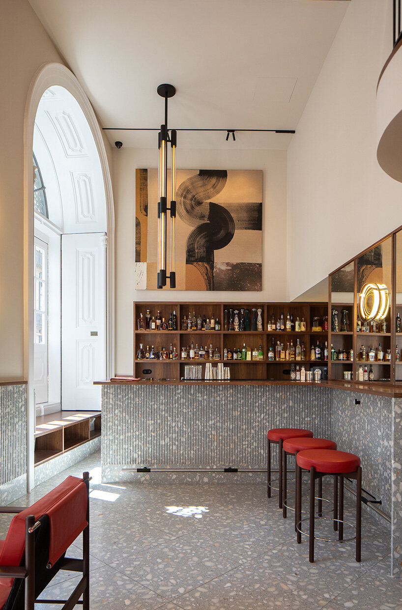 atelier sérgio rebelo converts historic bank building into multi-space restaurant in porto