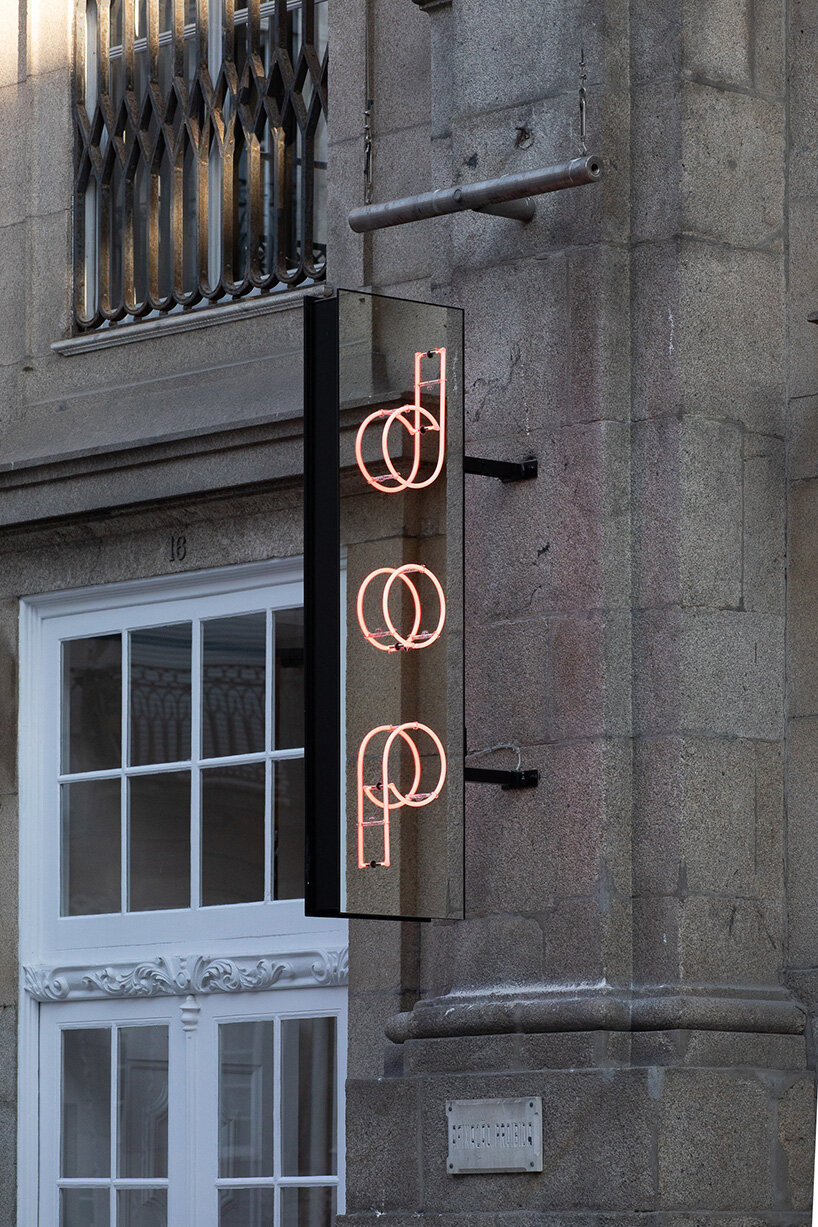 atelier sérgio rebelo converts historic bank building into multi-space restaurant in porto