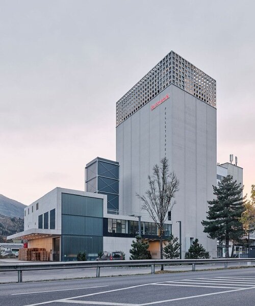 concrete crown transforms 1978 grain silo in austria into storing center for wood pellets