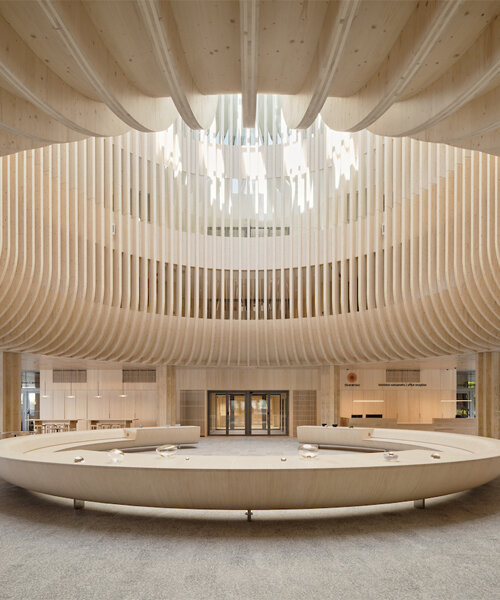 katajanokan laituri landmark in helsinki greets visitors with a cascading wooden skylight