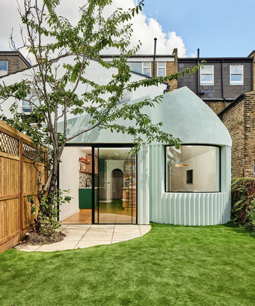 a series of square and circular skylights introduces geometric light casts within minty house