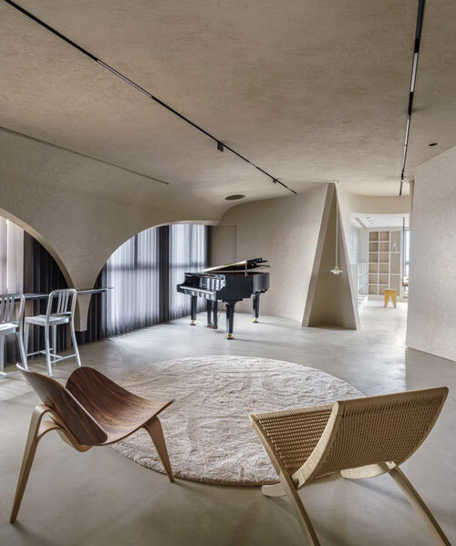 studio X4 explores open-plan living concept through curved diagonal partition