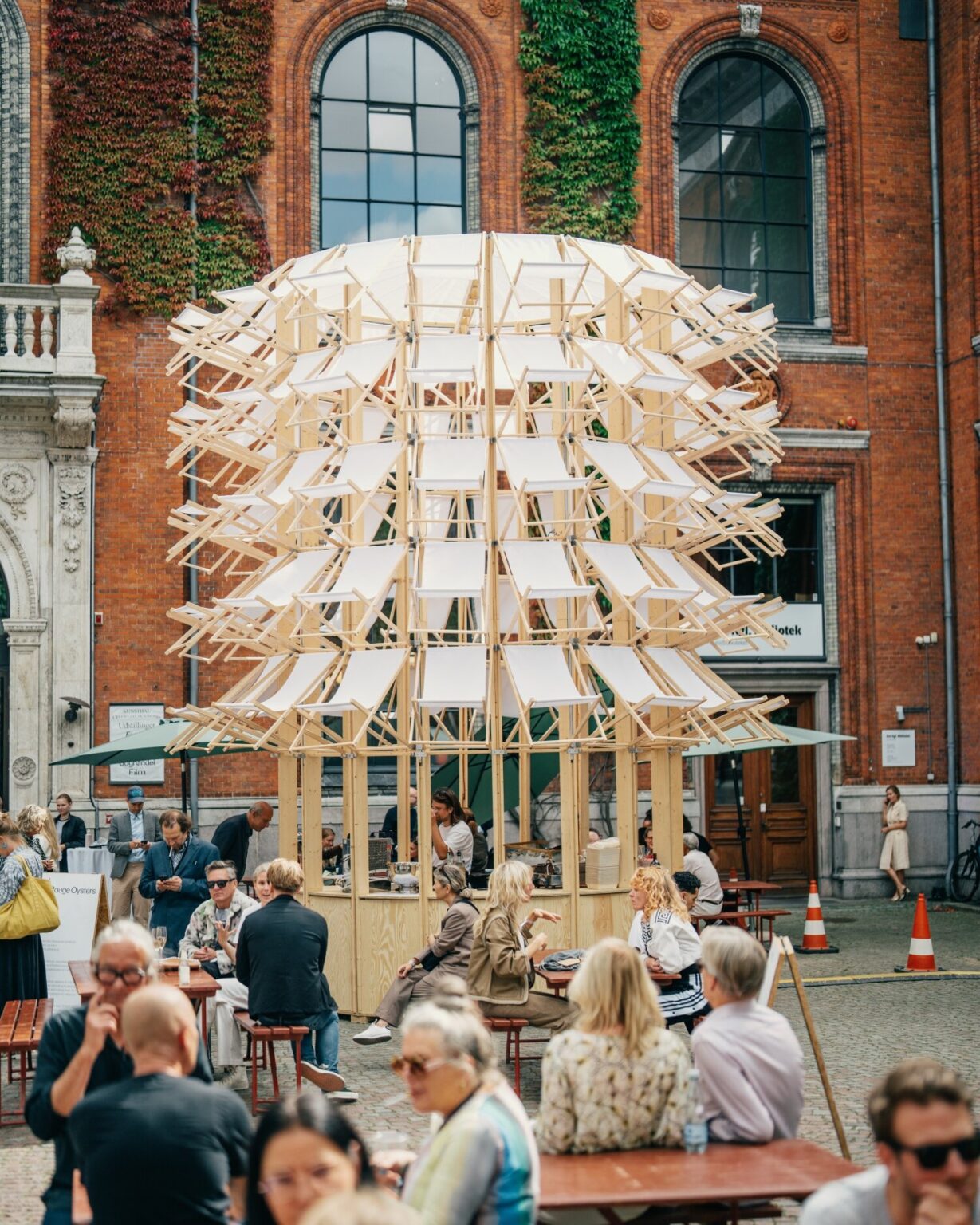 kinetic pavilion of wooden deck chairs by lasovsky johansson blooms in ...