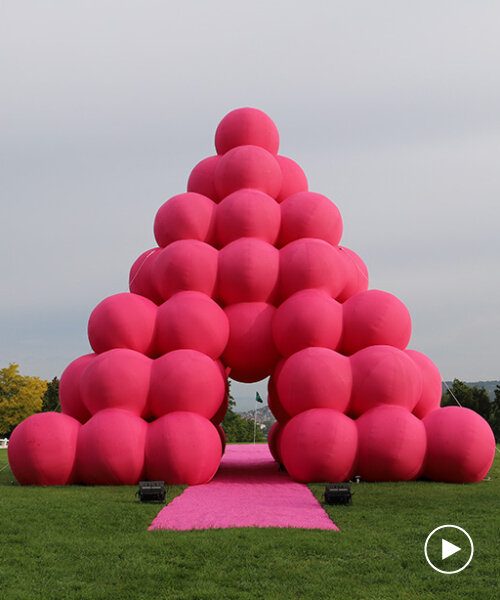 cyril lancelin stacks inflatable pink spheres into monumental pyramid in france