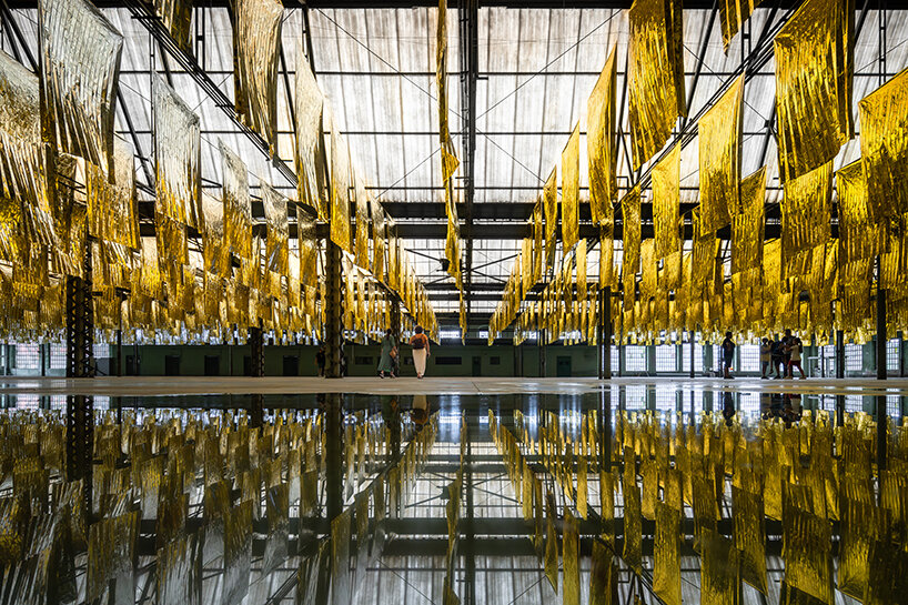 reflective sea of salvage blankets by SpY whispers inside former oviedo weapons factory