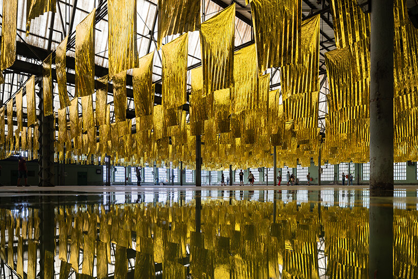 reflective sea of salvage blankets by SpY whispers inside former oviedo weapons factory