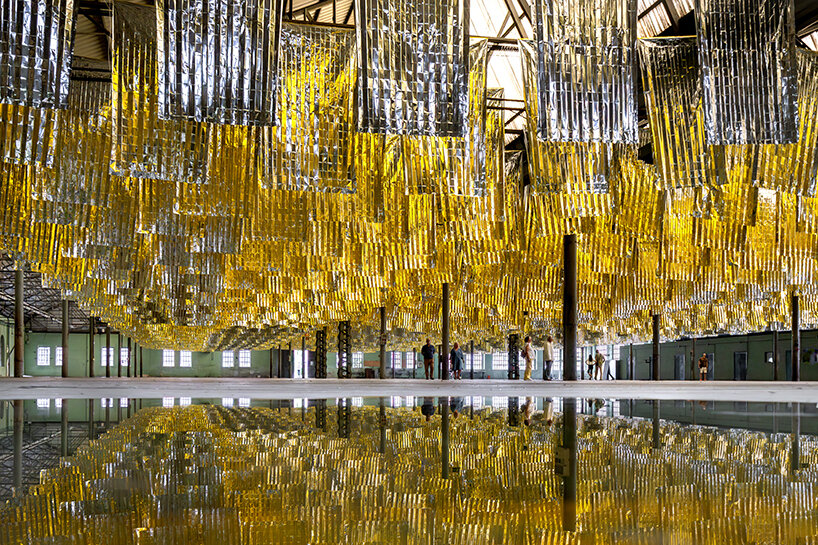 reflective sea of salvage blankets by SpY whispers inside former oviedo weapons factory