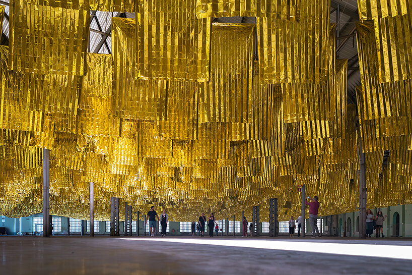 reflective sea of salvage blankets by SpY whispers inside former oviedo weapons factory