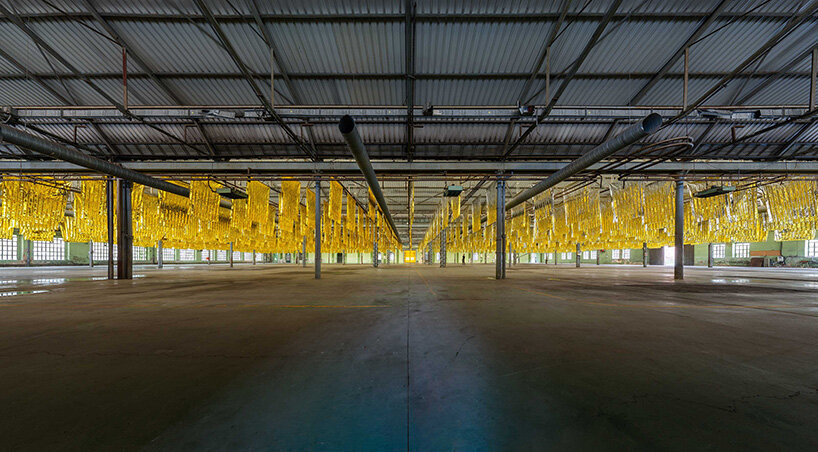 reflective sea of salvage blankets by SpY whispers inside former oviedo weapons factory