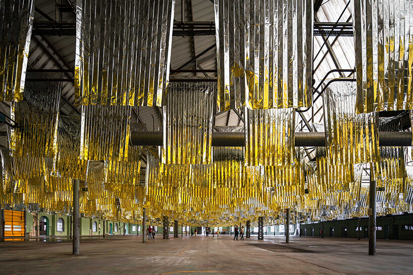 reflective sea of salvage blankets by SpY whispers inside former oviedo weapons factory