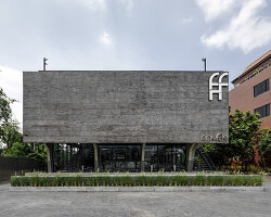 solid exterior minimizes visual noise in bangkok's monochromatic phuffle restaurant