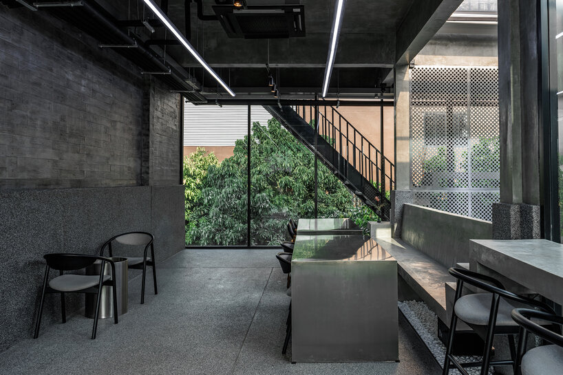 solid exterior minimizes visual noise in bankog's monochromatic phuffle restaurant