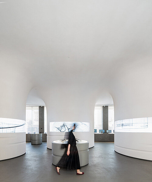 spiral pathways define cylindrical forms in digikala flagship store's fluid interior