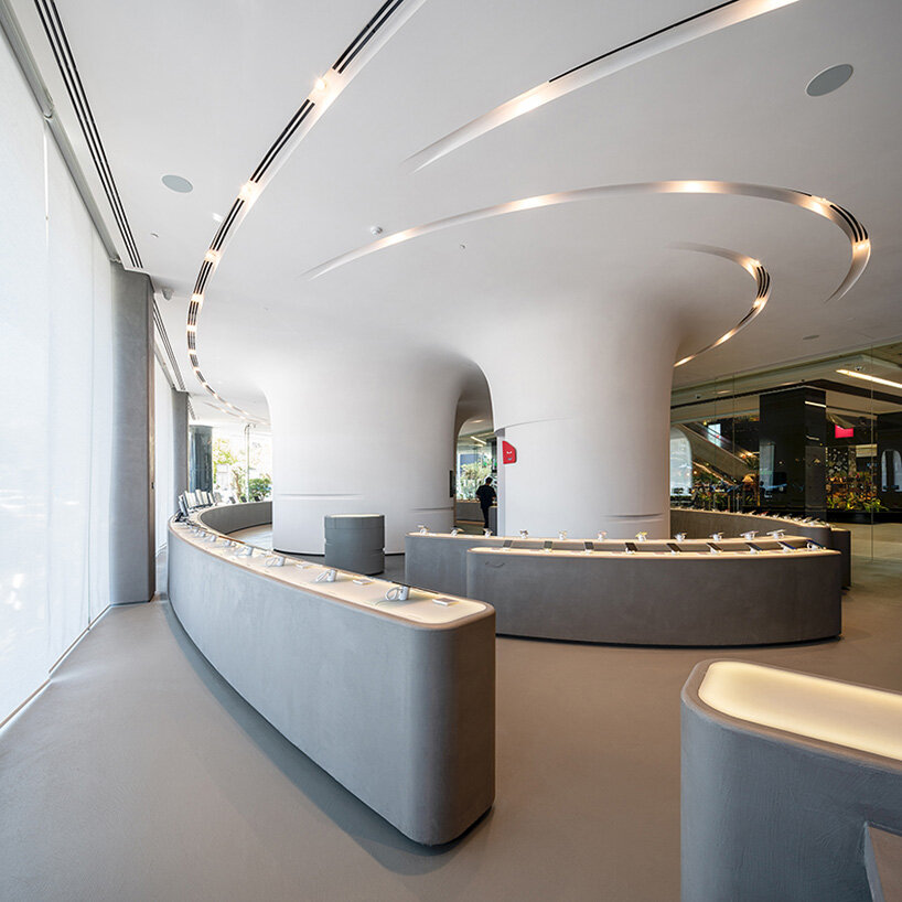 Los canales en espiral definen la forma cilíndrica del fluido interior de la tienda insignia de Digikala.