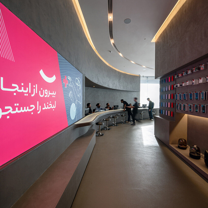 spiral pathways define cylindrical forms in digikala tehran flagship store's fluid interior