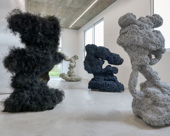 studio lilo molds moss like clay to create these botanical sculptures exhibited in berlin
