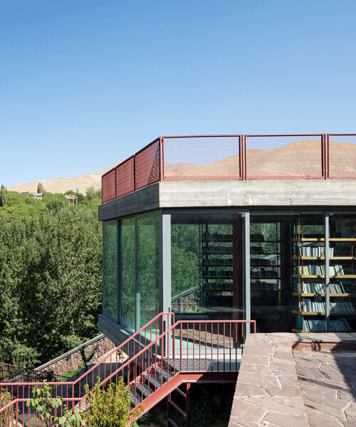 suspended bookshelves float within villa's glazed volume by ayeneh office in tehran