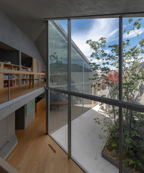 yuko nagayama cuts folding courtyard into this secluded 'diagonal house' in tokyo