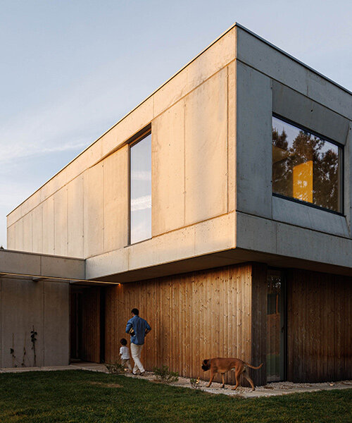 um para um builds home for mundão, portugal from concrete and warm timber